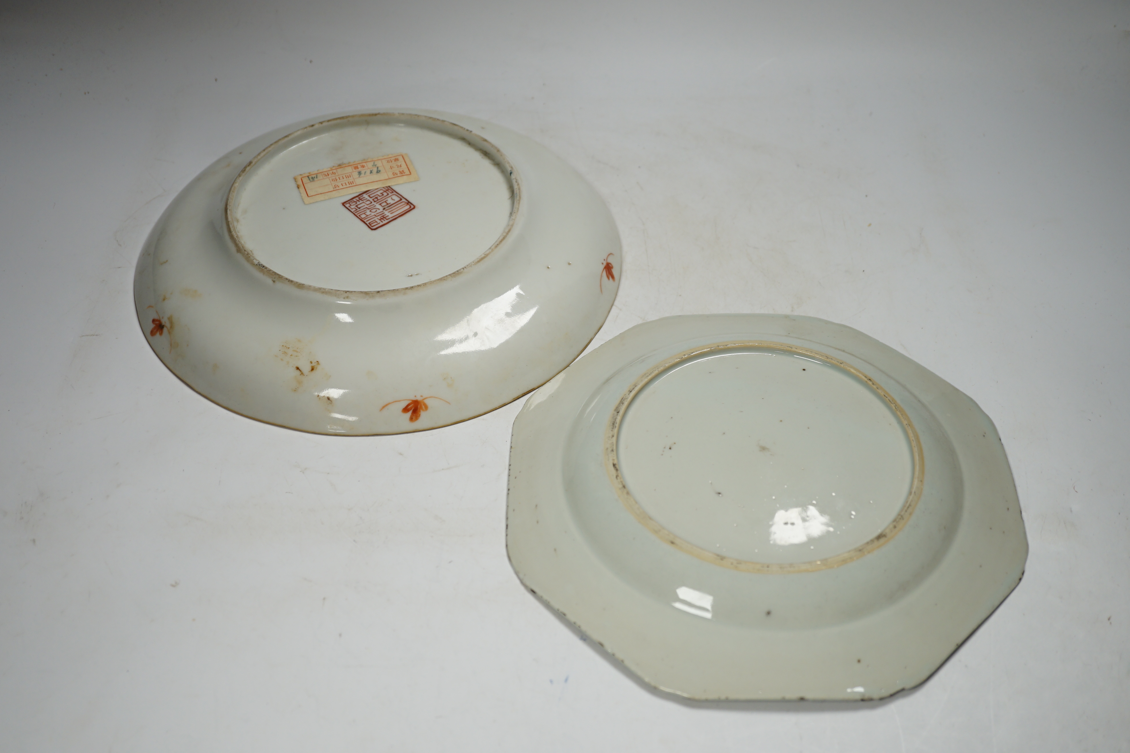 A Chinese famille rose ‘boys’ saucer dish, Tongzhi seal mark and probably of the period (1862-1874) and an 18th century Chinese famille rose octagonal ‘cranes’ plate, dish 25cm diameter